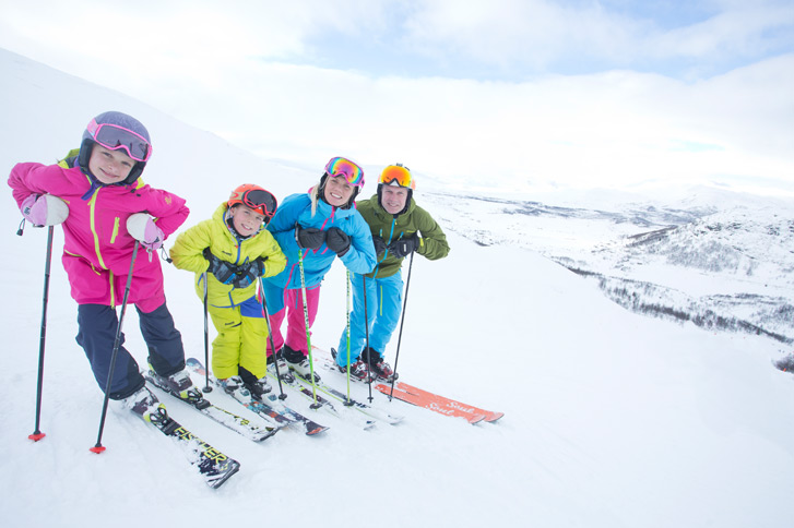 family skiing in norway