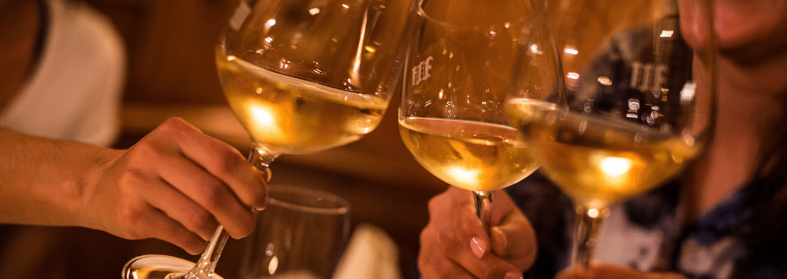 People drinking wine at an après ski bar in Switzerland