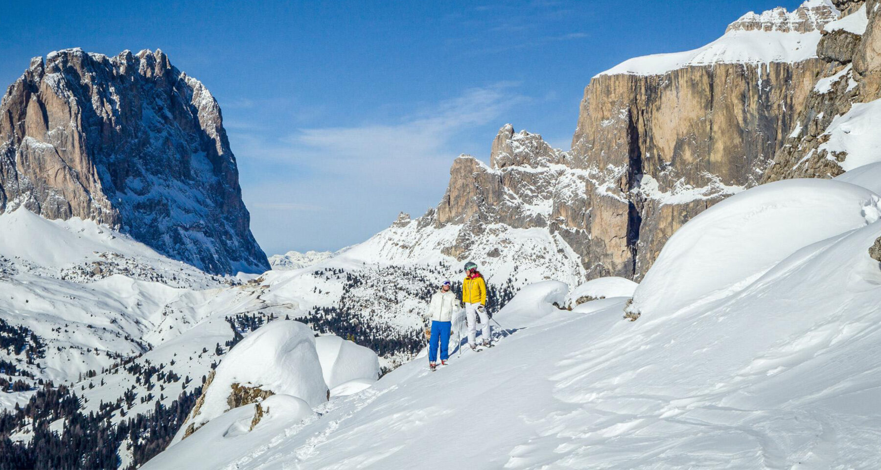 Skiers on the mountain at Val di Fassa ski resort